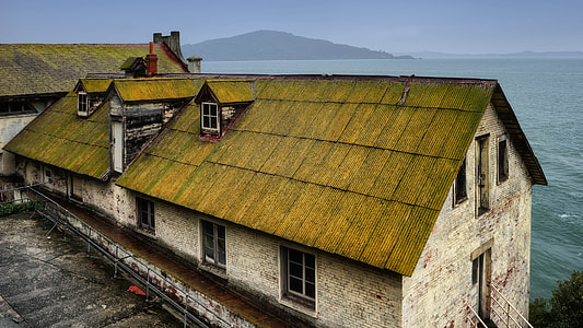 gray concrete house near body of water thumbnail