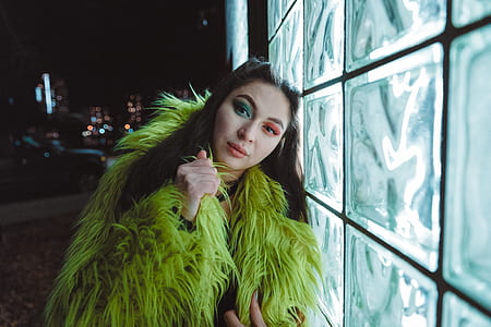 woman leaning on glass block wall thumbnail