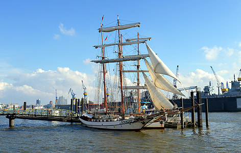 white wooden sailboat on dock thumbnail