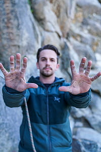 man raising his hands forward thumbnail