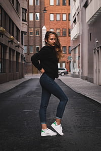 woman standing in the middle of road thumbnail