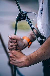 person holding green bungee cord thumbnail