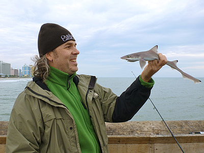 man holding shark thumbnail