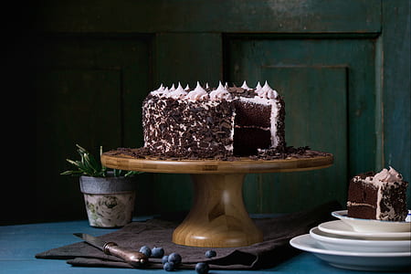 chocolate cake on brown footed tray thumbnail