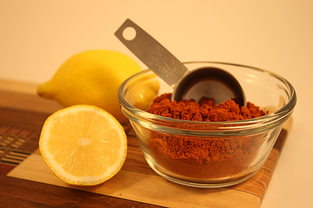 slice lemon beside spicy powder in bowl thumbnail