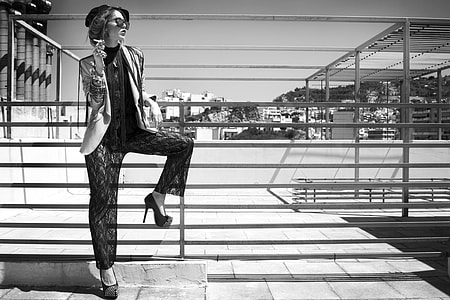woman standing near the metal railings thumbnail