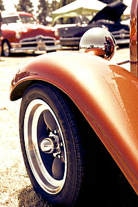 selective focus photo of classic orange vehicle thumbnail