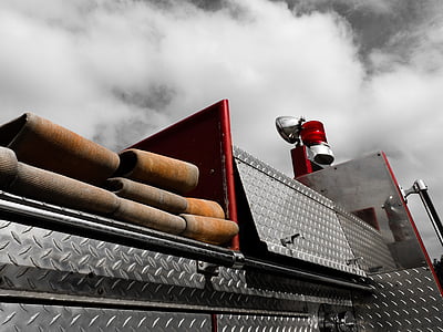 close up photography of diamond-plated fire truck thumbnail