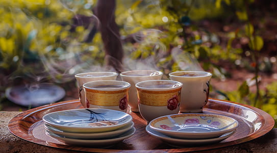 Cups and Saucers on Round Brown Tray thumbnail