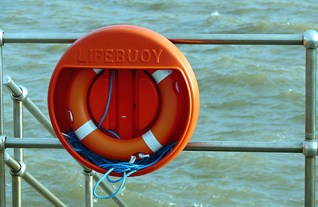lifebuoy hanging on ship rails thumbnail
