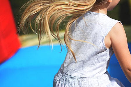 view of girl wearing blue sleeveless dress thumbnail