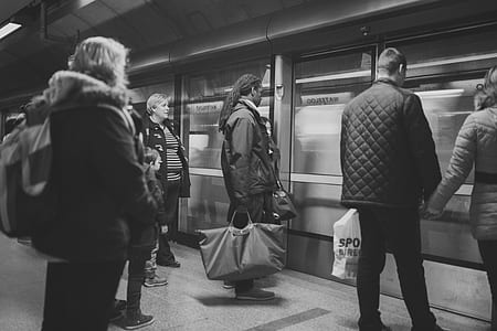 Man on Black Jacket Holding Woman on Brown Jacket thumbnail