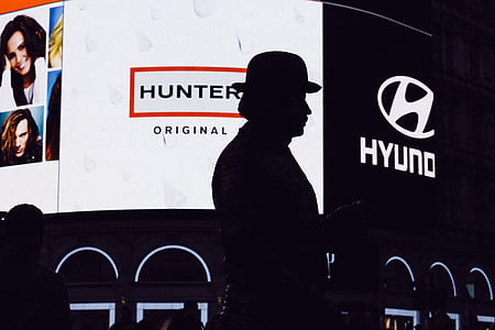 silhouette of person with bowler hat at night thumbnail