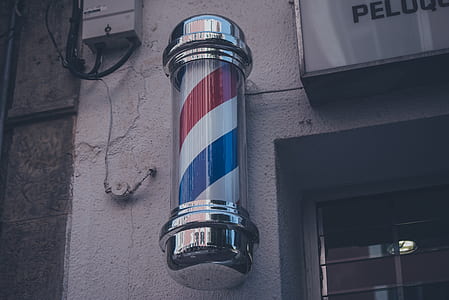 barber's pole on wall near window thumbnail