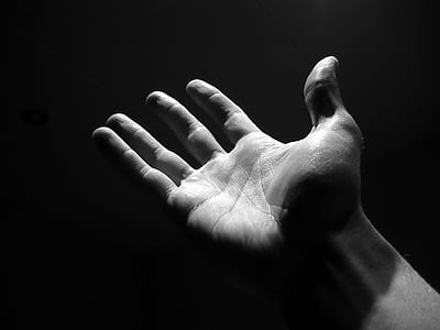 grayscale photo of right person's hand thumbnail