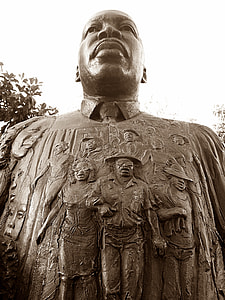 concrete statue of man brownscale photo thumbnail