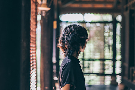 person wearing black crew-neck shirt thumbnail