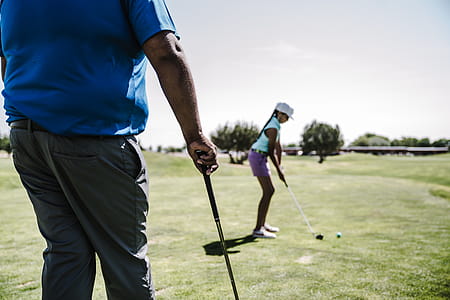 Shallow Focus Photography of Woman Playing Golf thumbnail