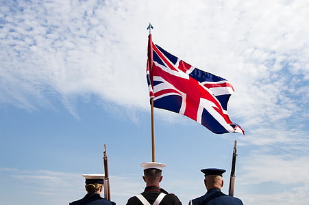 people standing in front of Union Jack Flag during daytime thumbnail
