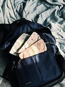 three coin purses on backpack thumbnail