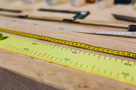 Close-ups of rulers on a wooden table thumbnail