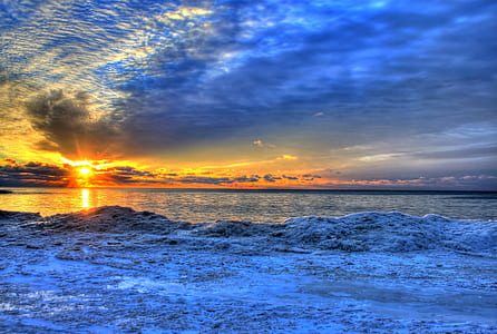 photo of sea waves during golden hour thumbnail
