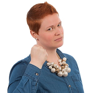 woman in blue denim jacket showing fist thumbnail