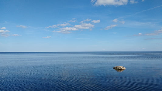 rock on body of water thumbnail