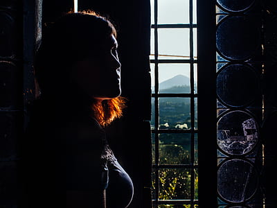 woman standing near the window thumbnail