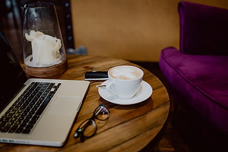 Cup of coffee on table in cafe thumbnail
