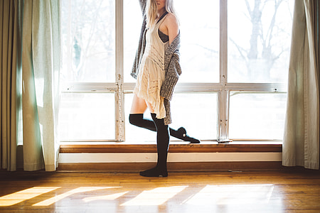 woman wearing white knitted sleeveless dress thumbnail
