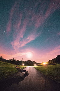 person lying on lounger under starry sky thumbnail