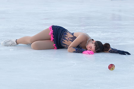 woman lying on ice wearing blue gown thumbnail