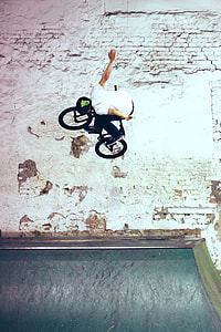 man riding BMX bike in mid air thumbnail