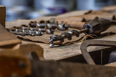 selective focus photography of drill bit thumbnail