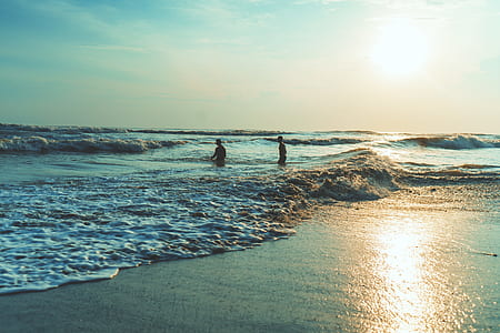two person standing on sea thumbnail