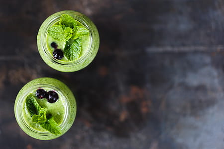 two green basil leaves on glass jars thumbnail
