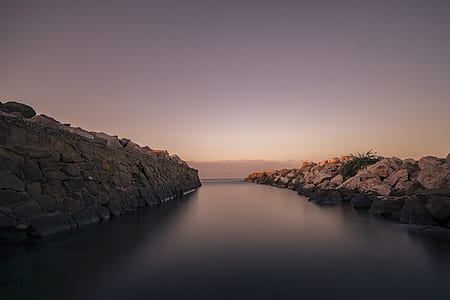 body of water between mountains thumbnail