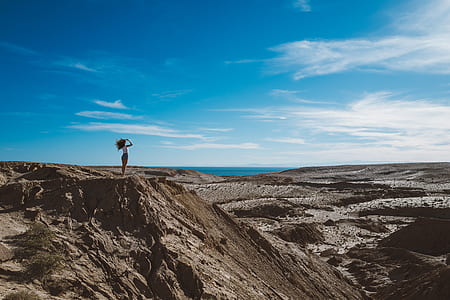 woman standing on cliff thumbnail