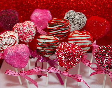 assorted-color coated chocolate pop lot on top of white surface thumbnail