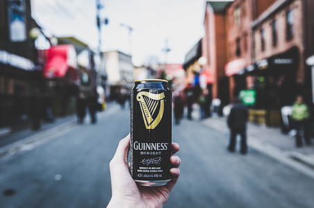 person holding Guinness beer can thumbnail