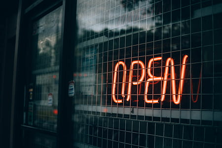 red Open neon signage with white steel frames thumbnail