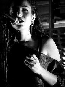 woman infront of microphone thumbnail