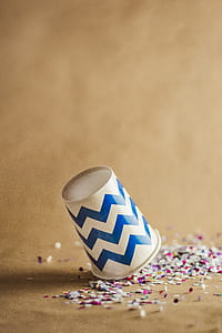 shallow focus photography of white and blue chevron disposable cup thumbnail