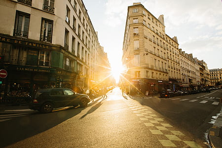 black SUV beside building during golden hour thumbnail