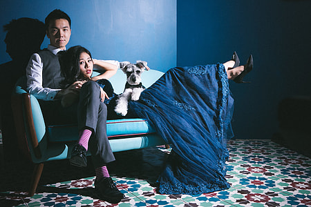 man and woman sitting and lying on sofa thumbnail