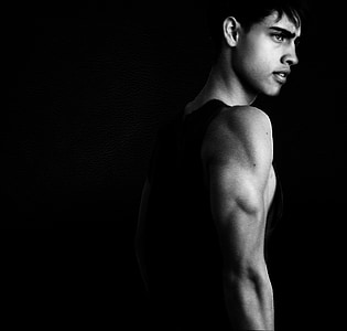 grayscale photo of topless man thumbnail