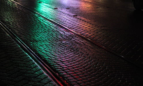 concrete road during night reflecting neon lights thumbnail