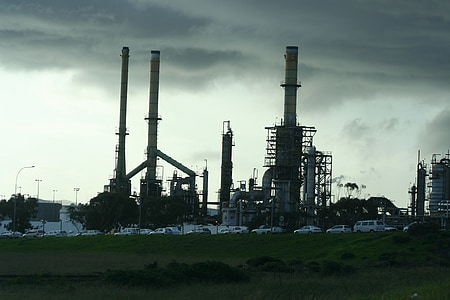 industrial factory under cumulus clouds thumbnail