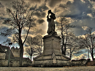 man holding slab above head statue thumbnail